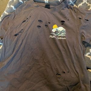 vibe n’ brand gray t-shirt with surfer skeleton on back,came with holes on back